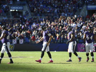 Baltimore Ravens' Joe Flacco walks off the field after throwing an incomplete pass on fourth down in the final minute of Sunday's game. (Nick Wass / AP)