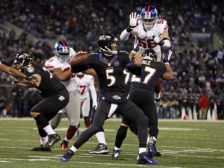 New York Giants linebacker Mark Herzlich (58) pressures Baltimore Ravens quarterback Joe Flacco (5) at M&T Bank Stadium on Dec. 23, 2012. (Mitch Stringer/US Presswire)